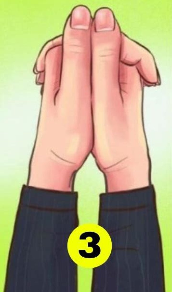When clasp hands which thumb on top?