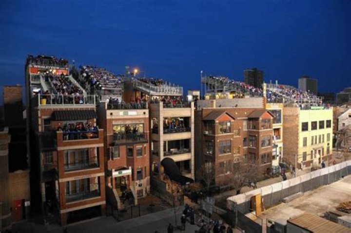 Who owns wrigley rooftops?